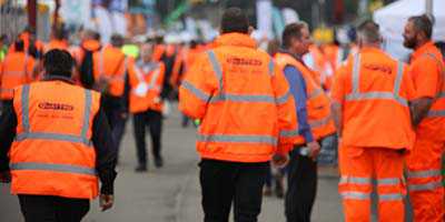 Team of rail workers wearing hi-vis jackets