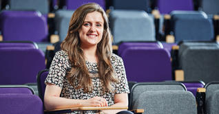 Emma Sutton sat in lecture theatre