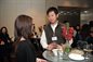 Xiaofeng Xu talking to a fellow alumni