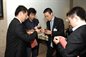 Alumni exchanging business cards and networking