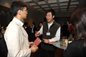 Xiaofeng Xu talking with fellow alumni