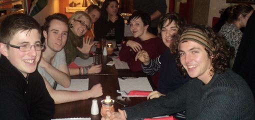 Photo of CWAS Society members at an evening dinner in an Ethiopian restaurant.