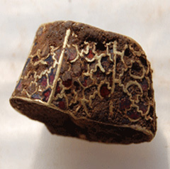 Photograph of a gold item from an excavation