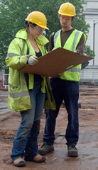 Photograph of two archaeologists on a dig site
