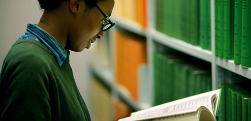 Photograph of a female student in the library