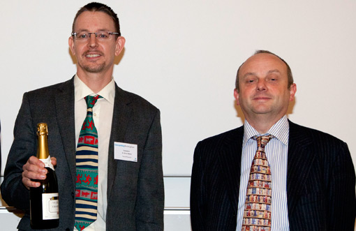 Dr Oliver Mason receiving champagne at the Enterprising Birmingham event