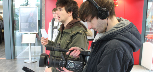 Photograph of two postgraduate students with cameras