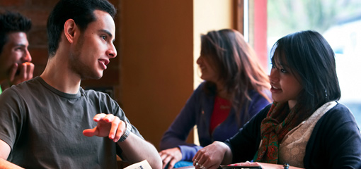 Photograph of two undergraduate students in conversation