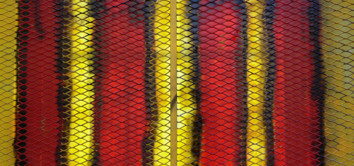 Photograph of red, black and yellow stripes on a window