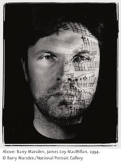 Photograph of a man with a musical score projected on his face
