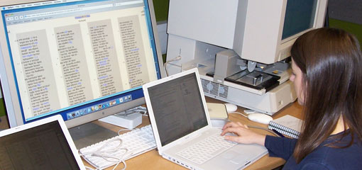 Photograph of a female researcher working on a laptop