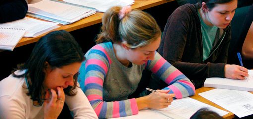 Students making notes during a lecture