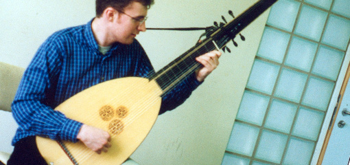 Photograph of a musician playing an early string musical instrument
