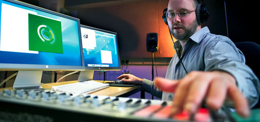 A musician at a mixing desk