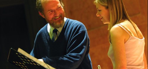 Photograph of a female music student with tutor