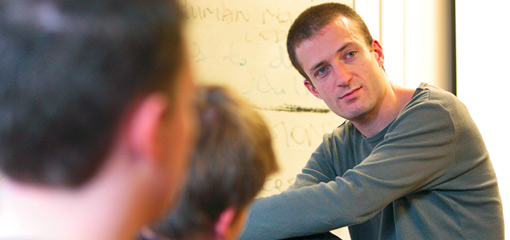 Photograph of a lecturer and students