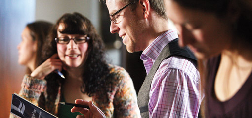 Photograph of smiling academics in discussion at the Shakespeare Institute