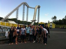 Civ-Soc members in front of a Rollercoaster