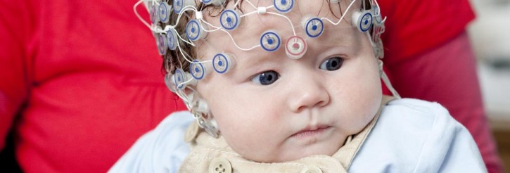 Baby wearing EEG sensor cap