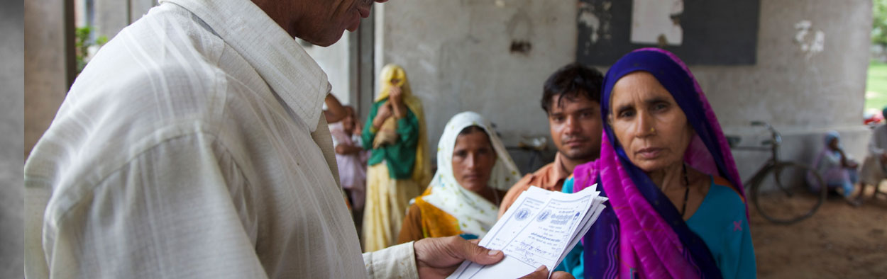 Doctor reading patient notes with a female patient in Indian clinic