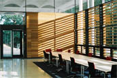 Photo of interor of NMR building, showing tables and sunlight through a window with blinds