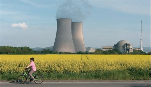 Cyclist in front of a nuclear power station
