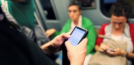 Mobile phone being used on a train