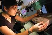 Female student with milling machine