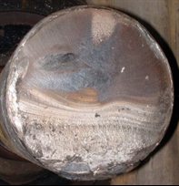 Railway axle failure - showing classic fatigue crack growth followed by final rapid fracture,