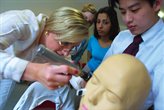 Students looking at a manequin