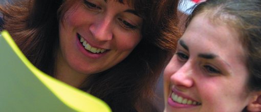 Teacher and students smiling