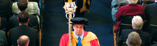 Mace bearer leading a degree congregation procession