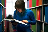 Student looking at books