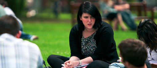 Students talking on the grass