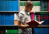 student studying in library