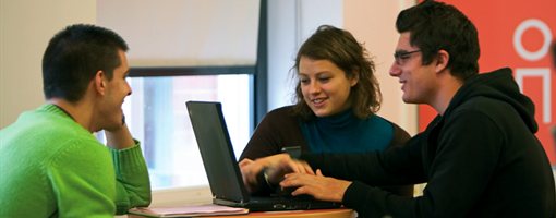 Students studying in library cafe