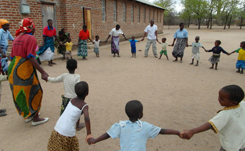 Children playing outside school in Malawi