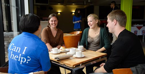 International students enjoying a cream tea during Welcome Week