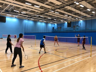 Students playing badminton at the UoB Sport and Fitness Centre