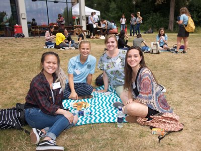 Students eating a picnic at welcome BBQ