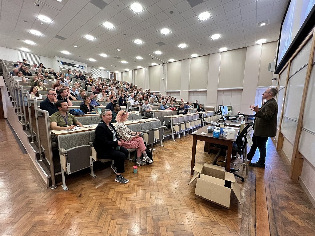 A speaker presenting at the 2024 Physics Conference