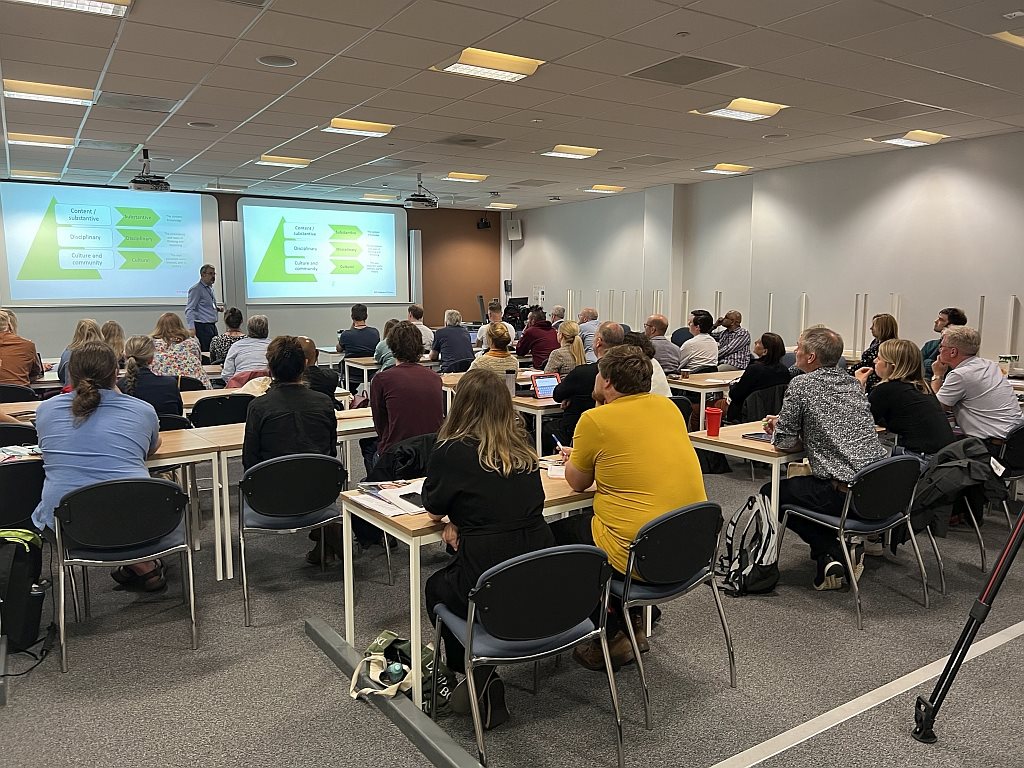 A speaker presenting at the 2024 Physics Conference