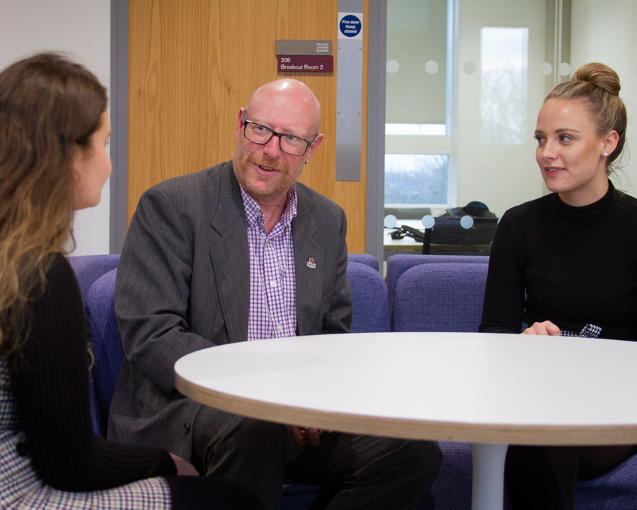 AshleyHorsey of Commonweal Housing meets two bursary students
