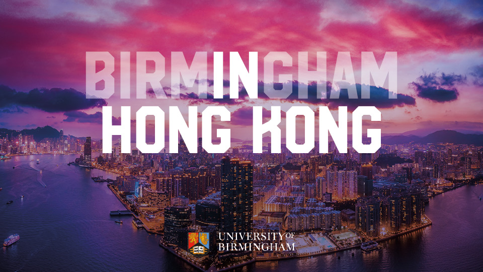 Aerial view of Hong Kong with pink dawn sky, with the words Birmingham In Hong Kong