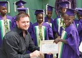 Matt Craig with young students in Ghana