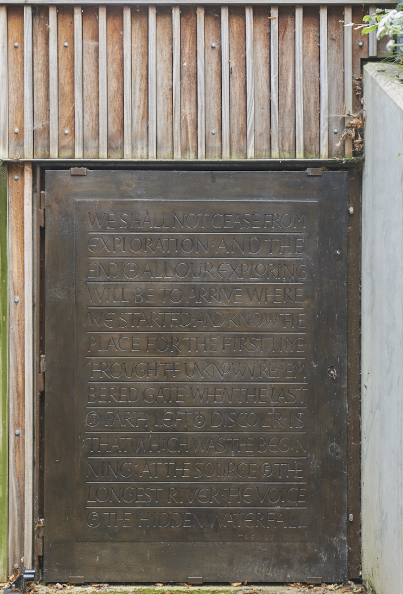 Carved bronze Pump Room Door by Betina Furnee featuring inscription of poetry by T.S Eliot