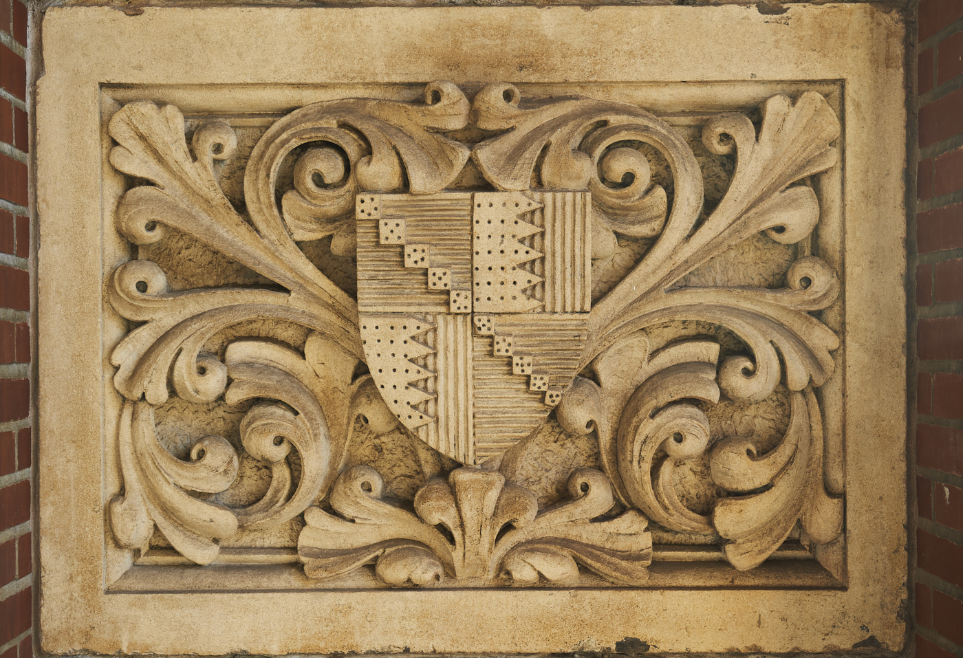 Detail of one of stone, carved plaques from Heraldic Shield from Mason College
