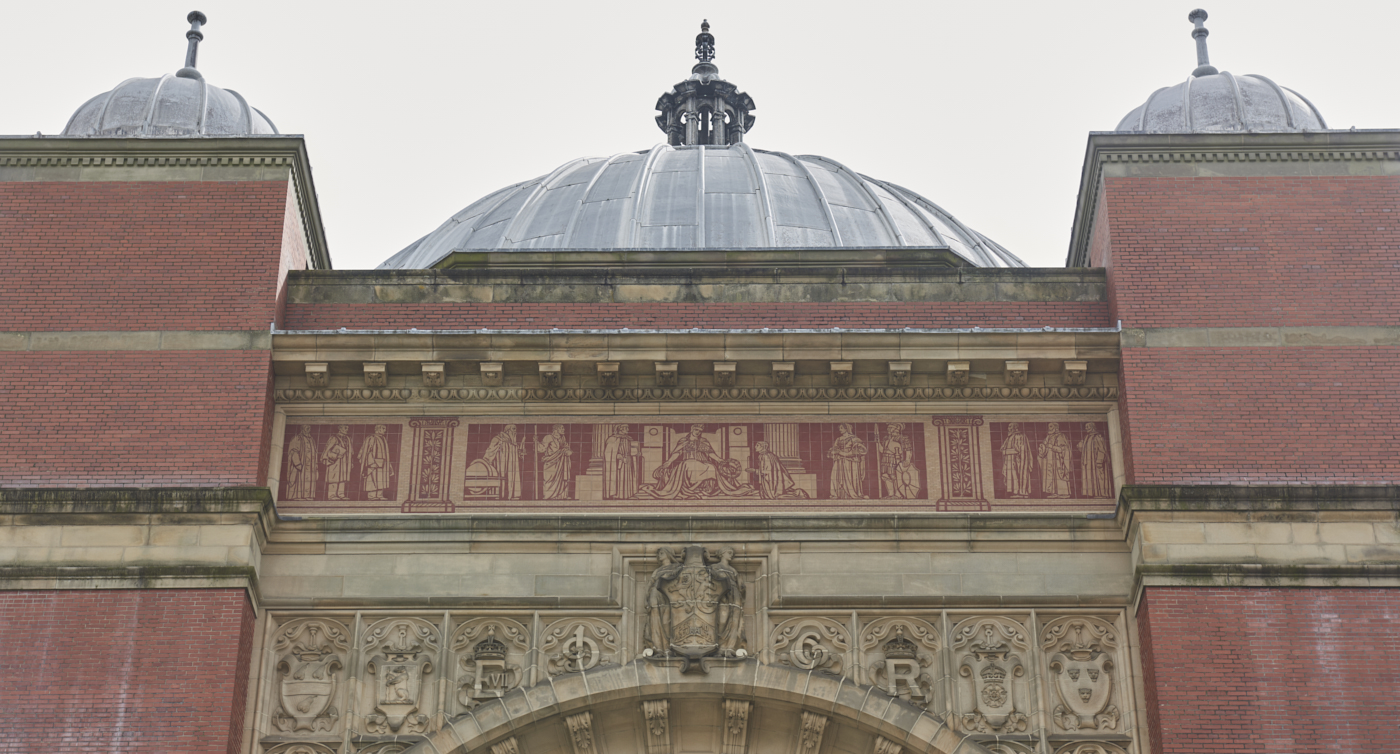 Learning ceramic frieze by Robert Anning Bell with domes of Aston Webb Building above