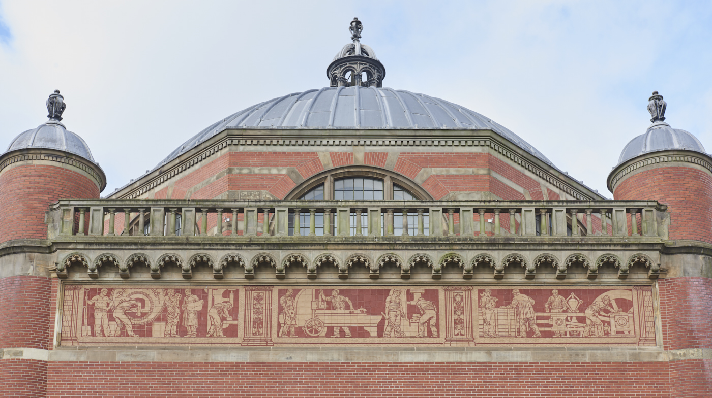 Mechanical Engineering ceramic frieze by Robert Anning Bell with domes of Aston Webb Building above