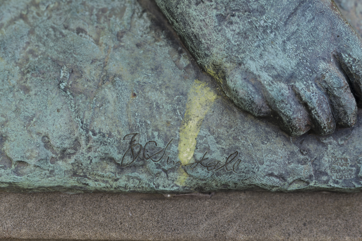 Detail close up of foot of Girl in a Hat bronze sculpture by Bernard Sindall